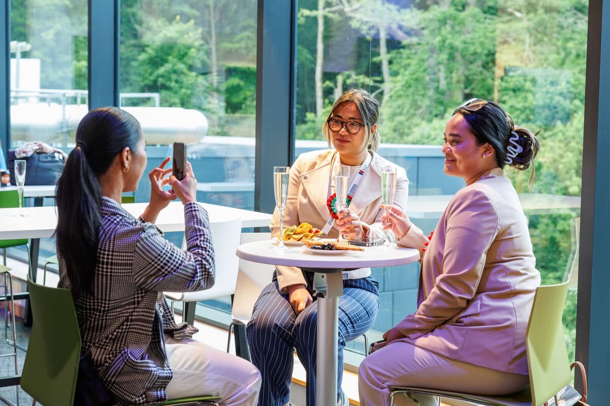 Guests sat in the café area with champagne and nibbles