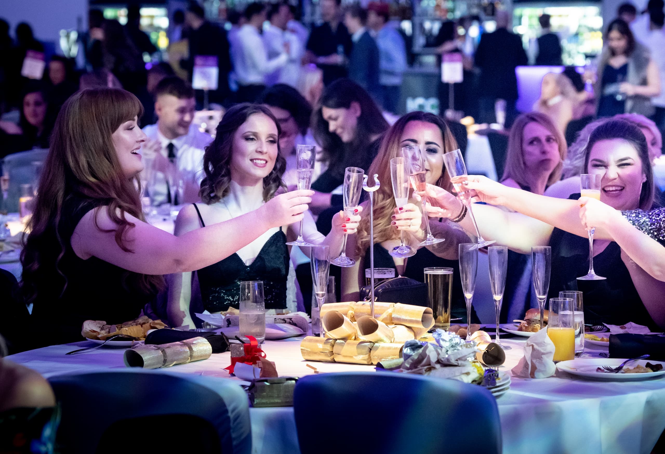 A group of friends enjoying drinks at festive Christmas party