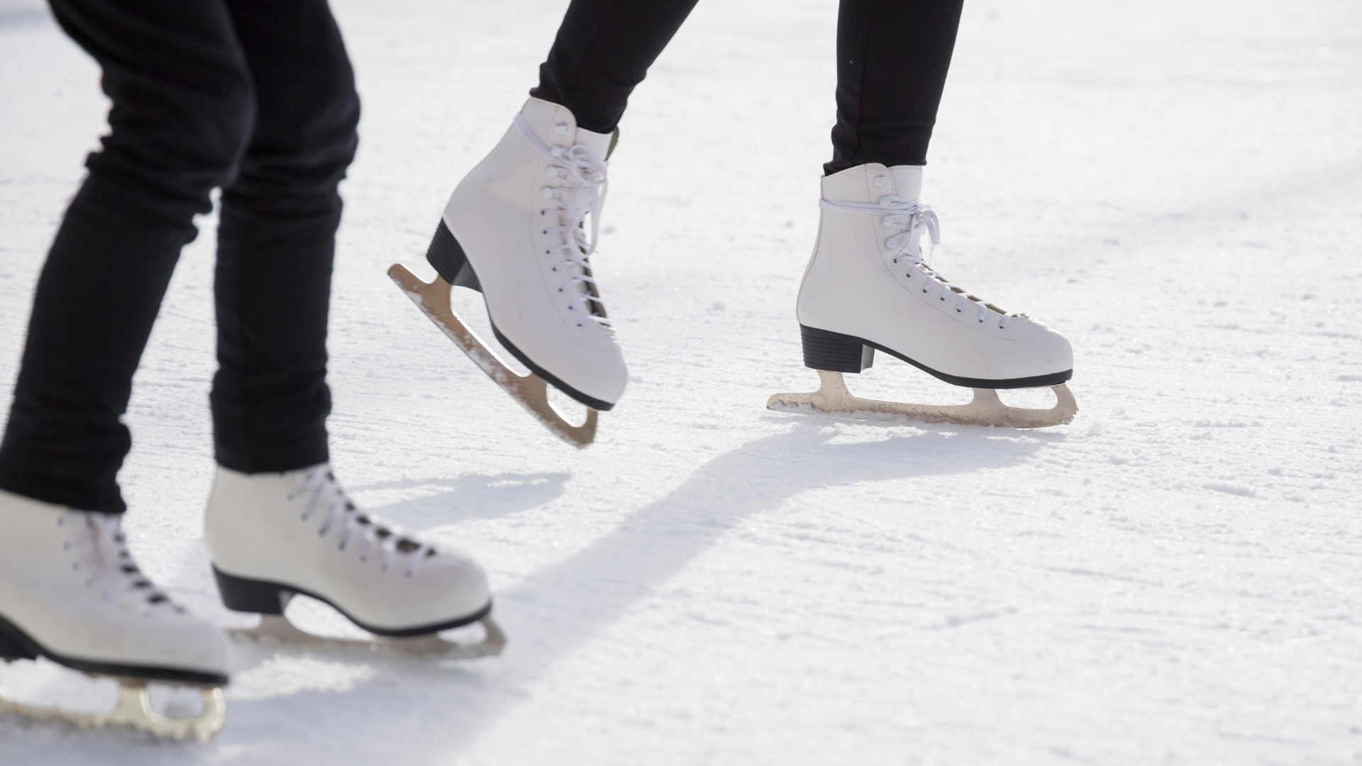 Picture shows two people Ice Skating in Newport